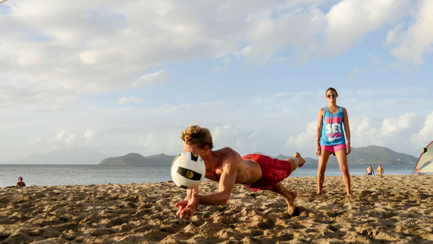 Tcharly playing volleyball on Nevis